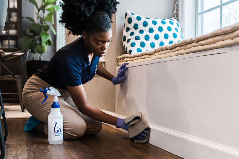 Home-Clean-Heroes-cleaner-wiping-down-baseboards